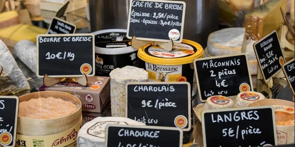 French cheeses displayed in a store in Paris.